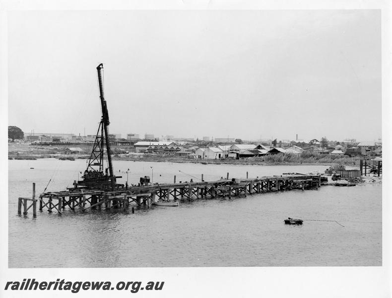 P00062
25 of 98 images showing views and aspects of the construction of the steel girder bridge with concrete pylons across the Swan River at North Fremantle.
