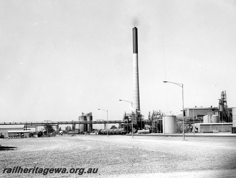 P00294
Western Mining's nickel concentrate plant at Kwinana, nickel concentrate wagons in the background, overall view of the plant.
