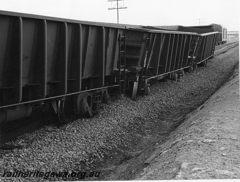 P00396
WO class standard gauge iron ore wagons, derailed near Kellerberrin, view along the line of wagons,  date of the derailment 19/2/1974

