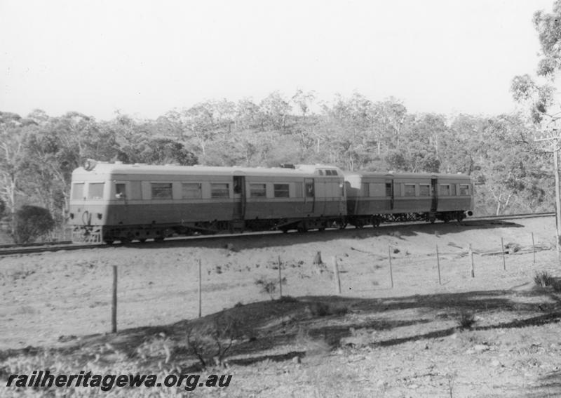 P00571
Governor class railcar with ADT class trailer near Clackline on the 8.55 am service from Katanning to Perth, ER line, end and side view.
