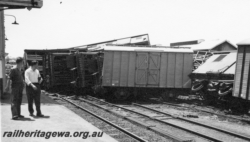 P01028
6 of 10 views of the derailment of A class 1501 at Northam Station, ER line. DC class 22508 at right angles to the track, other wagons piled up. date of derailment 2/11/1961
