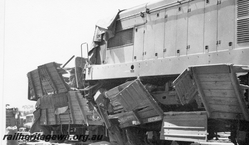 P01030
8 of 10 views of the derailment of A class 1501 at Northam Station, ER line. Loco on top of other wagons, date of derailment 2/11/1961
