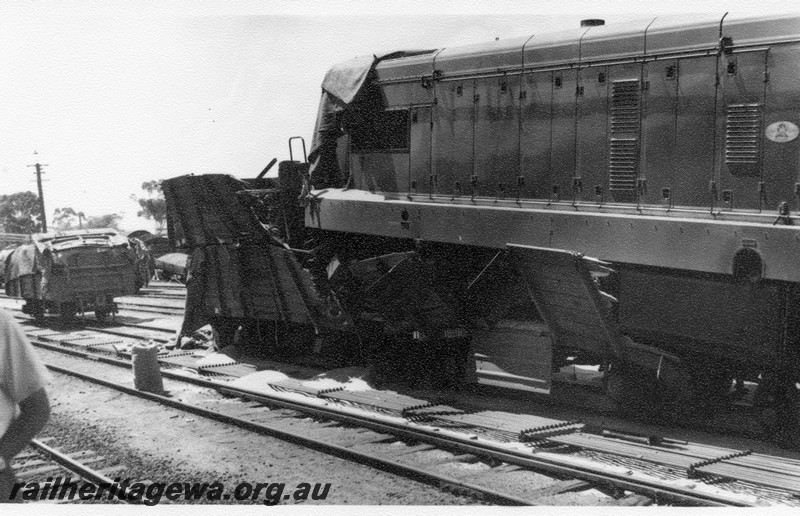 P01031
9 of 10 views of the derailment of A class 1501 at Northam Station, ER line. Loco on top of other wagons, date of derailment 2/11/1961
