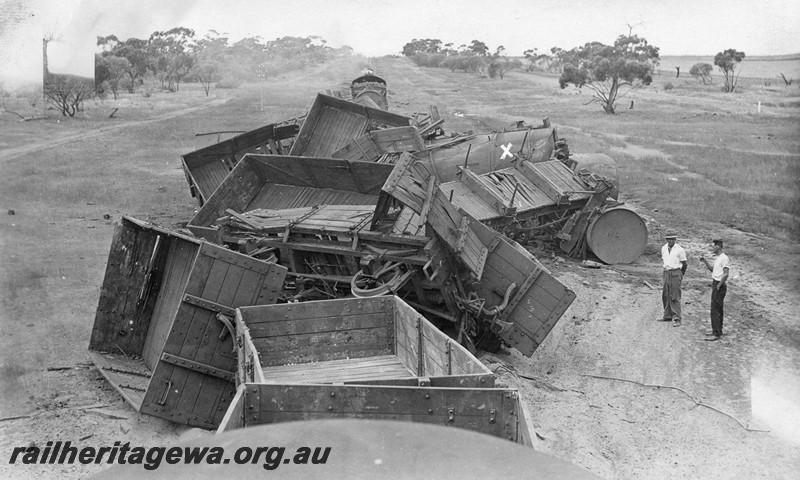 P01035
Line of derailed and damaged wagons looking towards Mullewa, NR line, view from the top of a van looking along the train.
