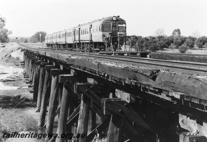 P01418
13 of 16 images of the pair of trestle bridges over the Canning River at Gosnells, SWR line, ADX class railcar set on the bridge, view taken from the north. 
