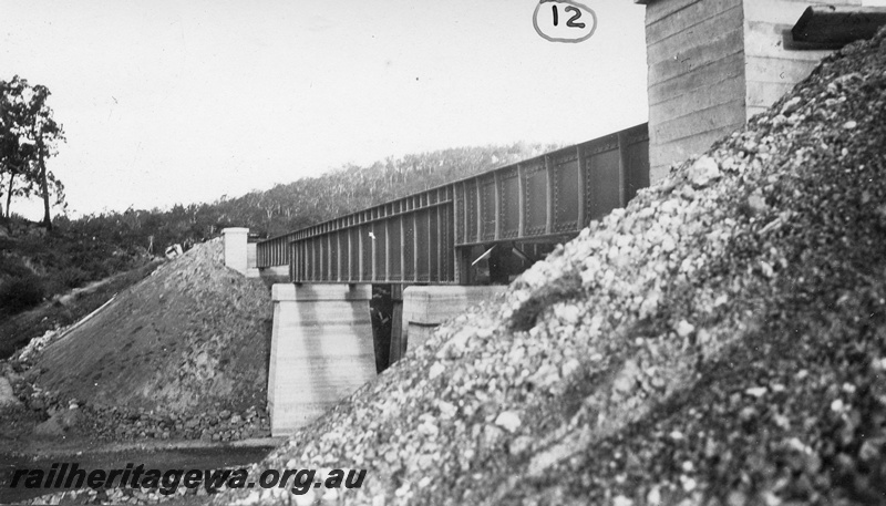 P01438
13 of 13 images of the construction of the duplicate steel girder bridge No.1 at 16 miles 25 chains on the ER through the John Forrest National Park, view of the bridge completed.
