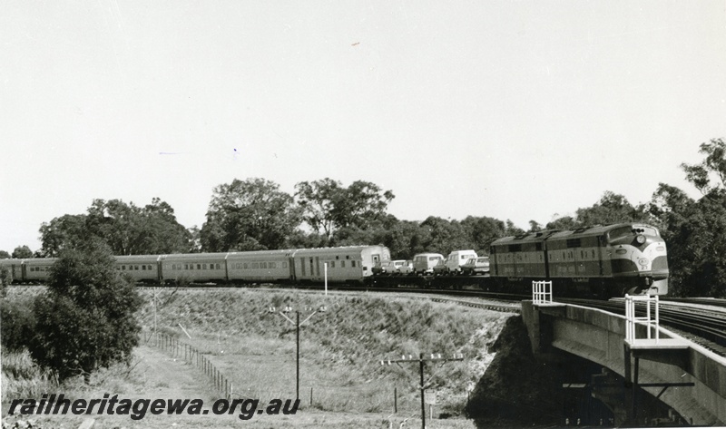 P01575
Commonwealth Railways (CR) GM class 27 heading the Indian Pacific and the Trans Australian towards Forrestfield, crossing the Helena River at Woodbridge
