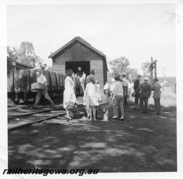P01680
Jarrahdale, front view of shed, open wagons, water column.
