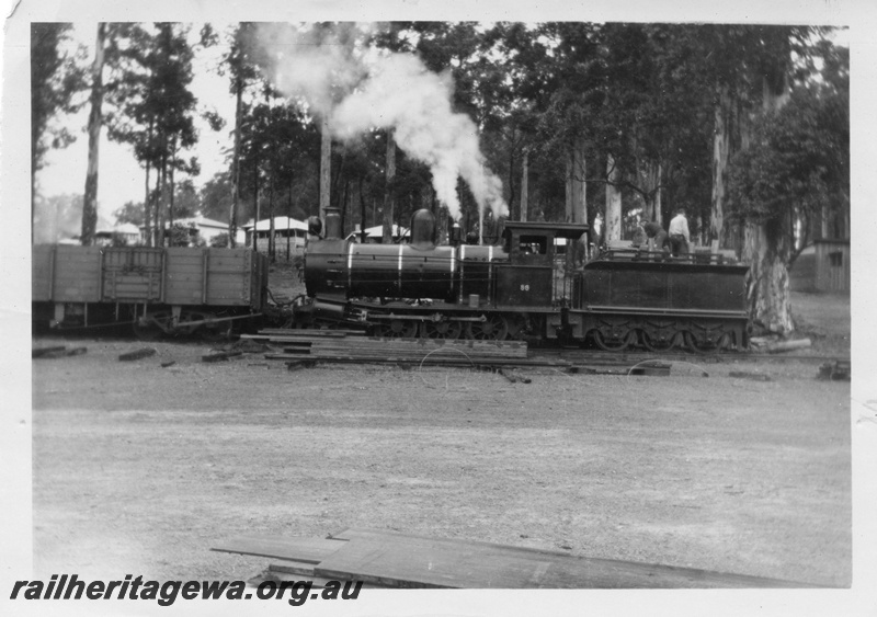 P01690
Bunnings YX class 86, Donnelly River, taking on wood, open wagon, side view, Donnelly River mill housing in the background.. 
