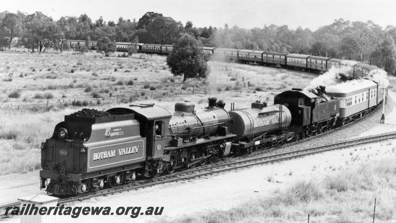 P01949
W class 903 and DD class 592 steam locomotives double heading, tender first, end and side view, at Wagerup, SWR line.
