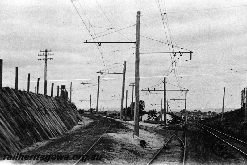 P01959
Line from East Perth to the East Perth Power station, view shows the overhead catenary, looking east.
