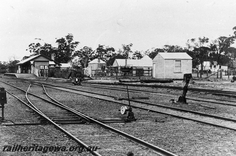 P02039
Station buildings, yard, point levers, Pingelly, GSR line, before take over by the WAGR, view along the yard, c1891
