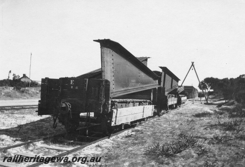 P02091
12 of 44 views of the construction of the railway at Esperance, CE line taken by Cedric Stewart, the resident WAGR engineer, H class wagon loaded with the segments of the turntable, end and side view.
