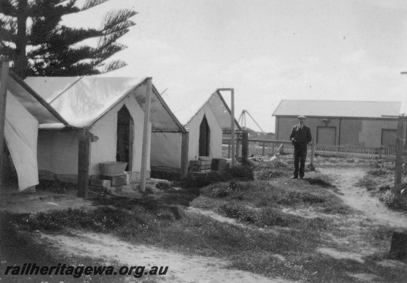 P02109
30 of 44 views of the construction of the railway at Esperance, CE line taken by Cedric Stewart, the resident WAGR engineer, worker's tents, derrick crane and goods shed in the background.
