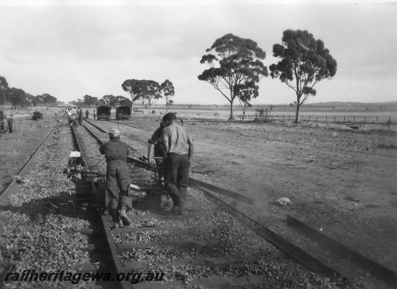P02110
1 of 7 views of the early relaying of the track on the EGR, c1950, gangers operating a machine on the rails, view along the track

