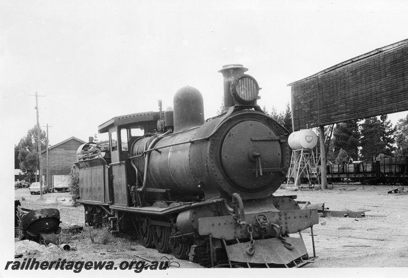 P02405
1 of 2. Ex SAR Y class 86, steam locomotive, side and front view, Bunnings mill at Manjimup.
