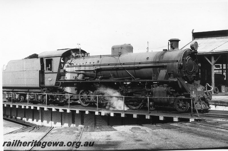 P02529
W class 920 steam locomotive on the turntable at Bunbury round house, side and front view, SWR line. c1970.
