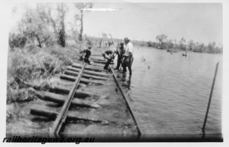 P02542
Flood damage to the track at Shaw River, track gang in attendance, PM line.
