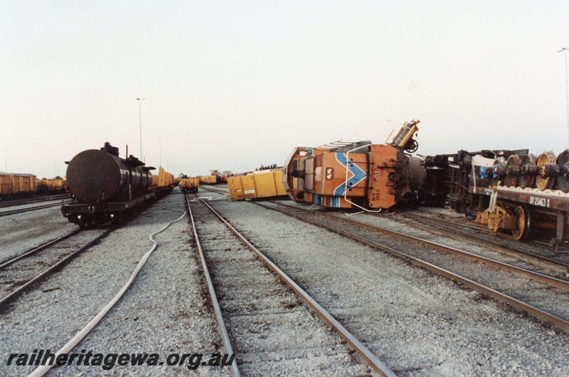 P02566
4 of 8, Derailment showing MA class 1862 diesel locomotive on its side, front view, Forrestfield marshalling yard.
