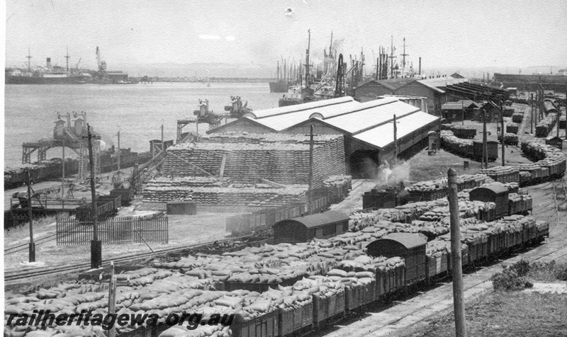 P02646
Open wagons loaded with bagged wheat, wheat stack, North Wharf Fremantle harbour.
