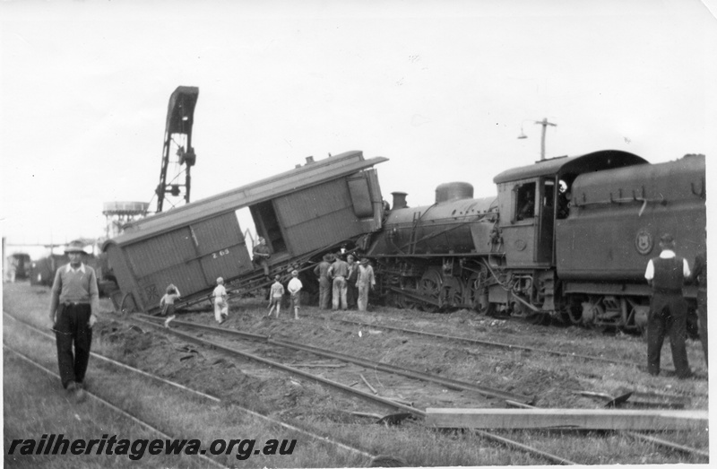 P02704
7 of 8. Rail smash at Yarloop. Brakevan side view and W class 957 side view, breakdown crane and water tower in the background, SWR line.
