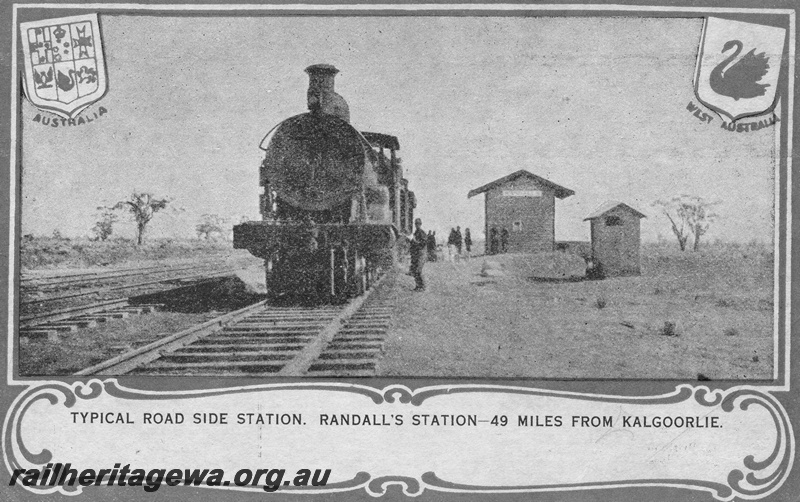P02836
Souvenir postcard of the Trans opening at Randall's station 49 miles from Kalgoorlie, front view of loco, station buildings, c1917.
