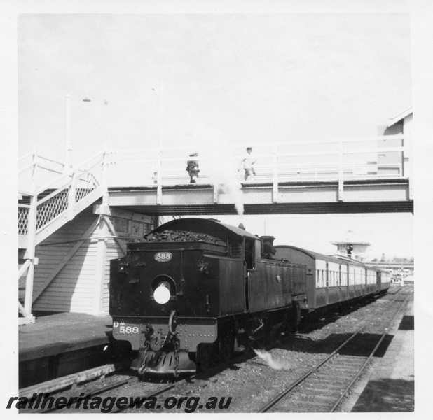 P02896
DM class 588 steam locomotive on passenger train working, bunker and side view, footbridge, Claremont, ER line.

