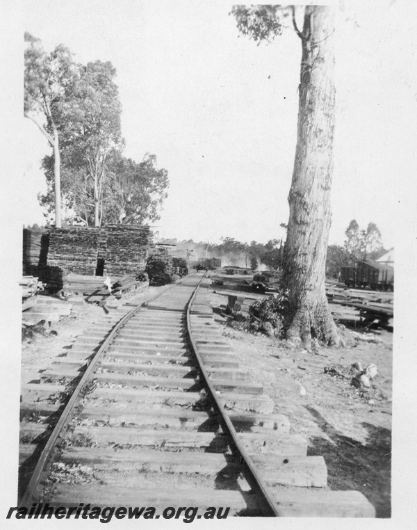 P02897
1 of 2, Yard at Bartons Mill, unballasted track, stacks of sawn timber, c1930.

