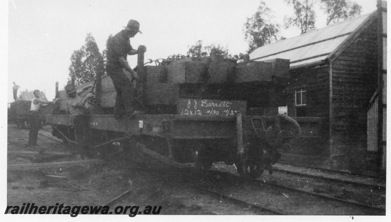 P02899
Loading timber onto Q type wagons, consignees details on the end of the wagon, Bartons Mill, c1930.
