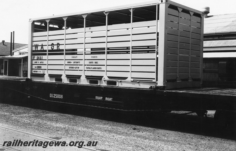P02968
WAGR steel cattle container No. 5451 on QU class 25008 flat top wagon in the all over black livery, side view.
