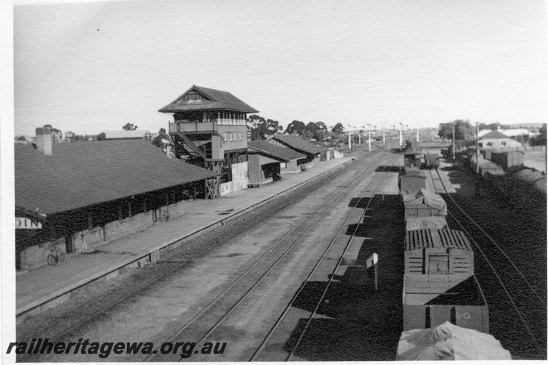 P03010
Yard and station buildings including signal box, passenger platform, signals and sidings Elevated view, Merredin, EGR line
