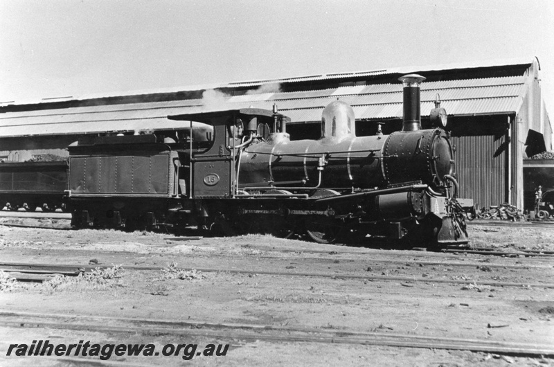 P03199
A class 15 steam locomotive, con rod missing, 6 wheel tender, side view.
