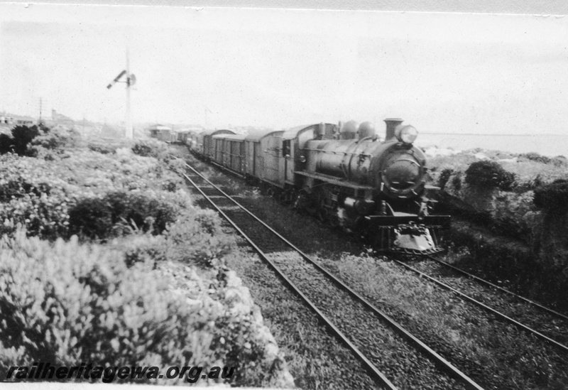 P03216
P class steam locomotive on a goods train, side and front view, signals, Leighton, ER line, c1930s.
