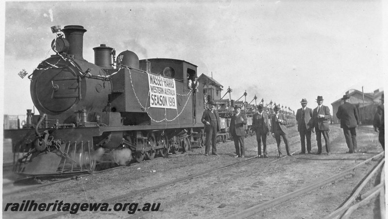 P03452
1 of 3, K class 186 steam locomotive hauling a special Massey-Harris farm machinery train, signal box in the background, front and side view, North Fremantle, ER line.
