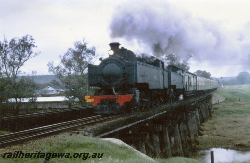 P03467
DM class double heading with DD class 592 steam locomotive on ARHS tour, on Gosnells bridge, front and side view.
