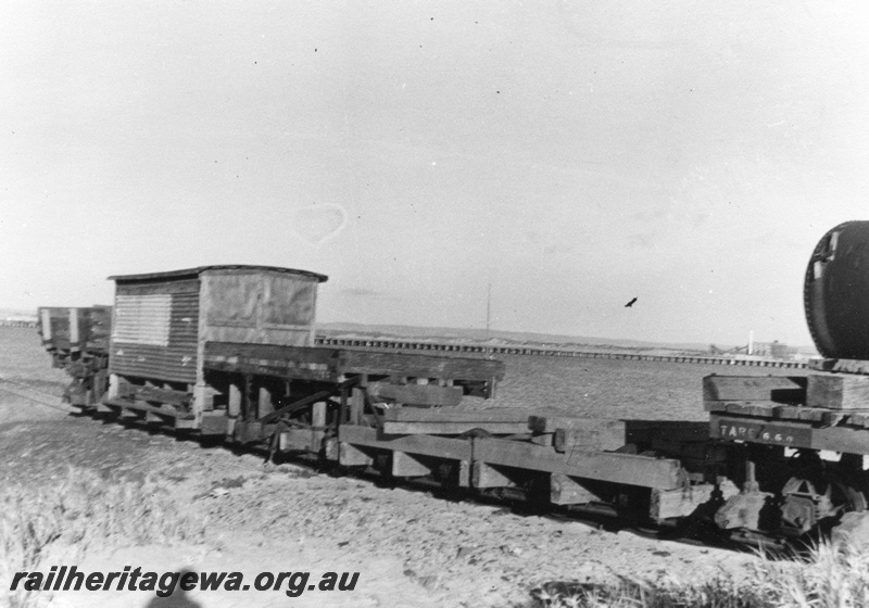 P03559
PWD wagons at Bunbury, includes side tipping wagons, view along the rake of wagons
