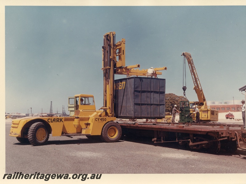 P03739
Clark 20000 lb forklift CY450, loading container onto flat top wagon, crane, North Fremantle, side view 
