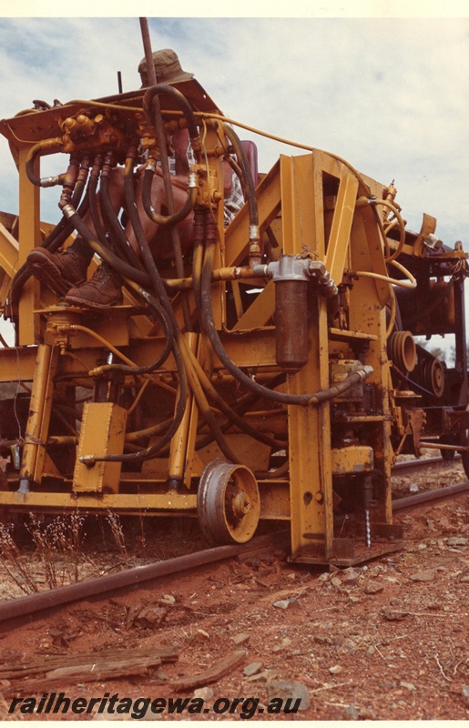 P03768
1 of 4: Tamper machine on standard gauge north of Kalgoorlie, front and side view.
