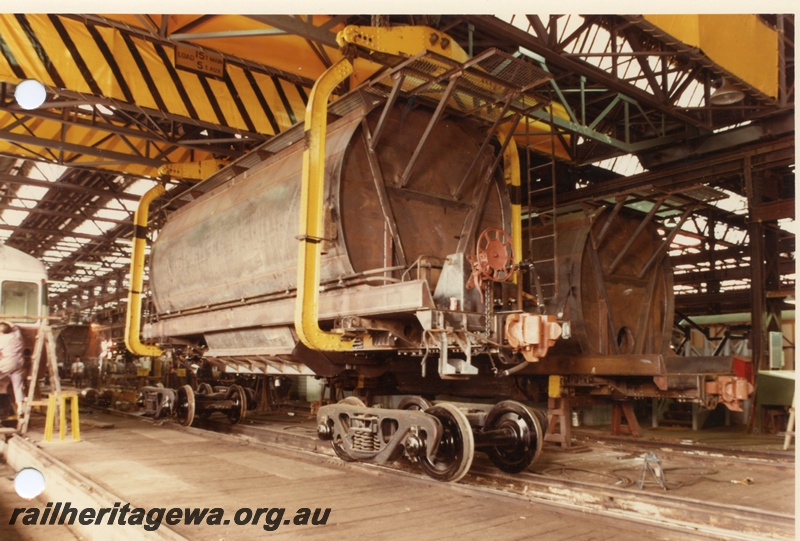P03828
2 of 7 images of XE class wagons, under construction, Midland Workshops, lowering onto bogies, side and end view
