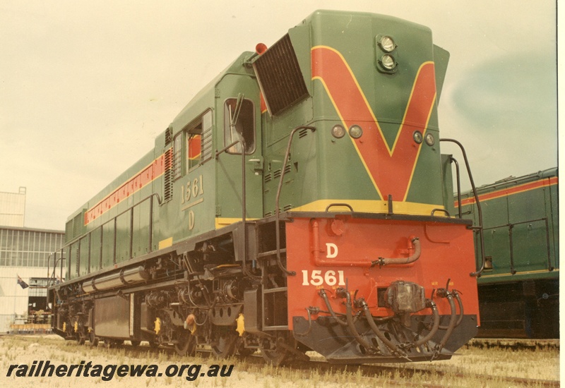 P03884
D class 1561 diesel locomotive, side and end view, green with red and yellow stripes livery, in as new condition.
