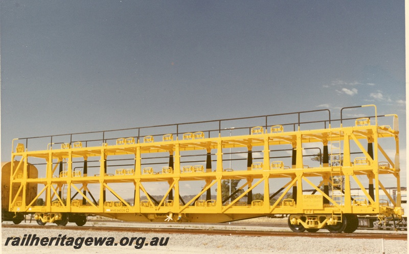 P03900
1 of 5, WMB class 34029 triple deck standard gauge motor vehicle carrying wagon, side view, in as new condition, in yellow livery, Forrestfield.
