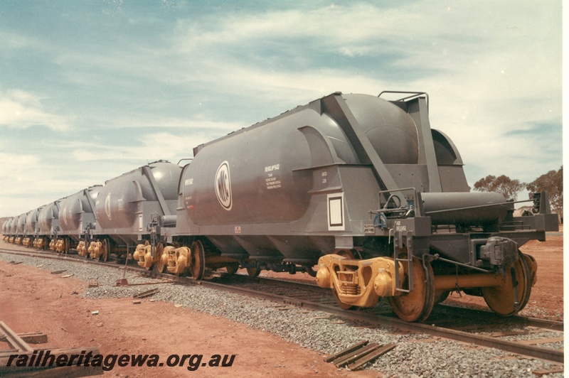 P03945
1 of 2, WMC (Western Mining Company) WN class standard gauge nickel concentrate tankers in as new condition, side and end view.
