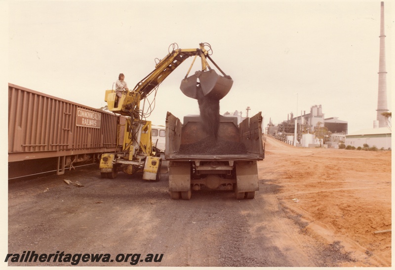 P04004
Commonwealth Railways (CR) wagon, being unloaded by excavator onto truck, Hampton nickel refinery, side view
