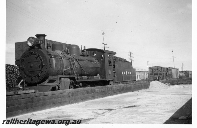 P04327
MRWA D class 19 steam locomotive, front and side view, next to water tower and coaling bank, Midland, MR line.
