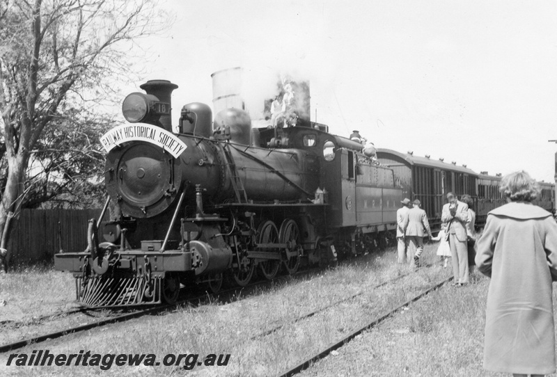 P04328
MRWA C class 18 steam locomotive, front and side view, taking on water, water tower, Muchea, MR line.

