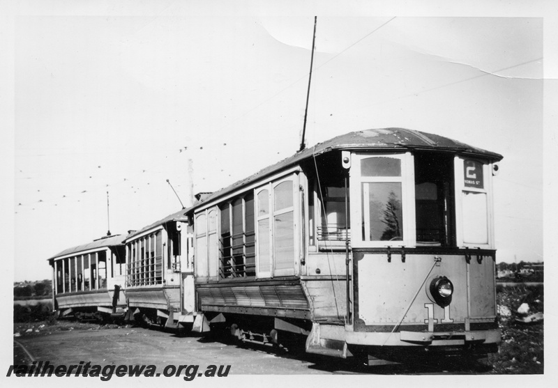 P04389
Four-wheeled tram No.11, on the No.2 Thomas St route, in front of two other trams, side and front view, Perth.
