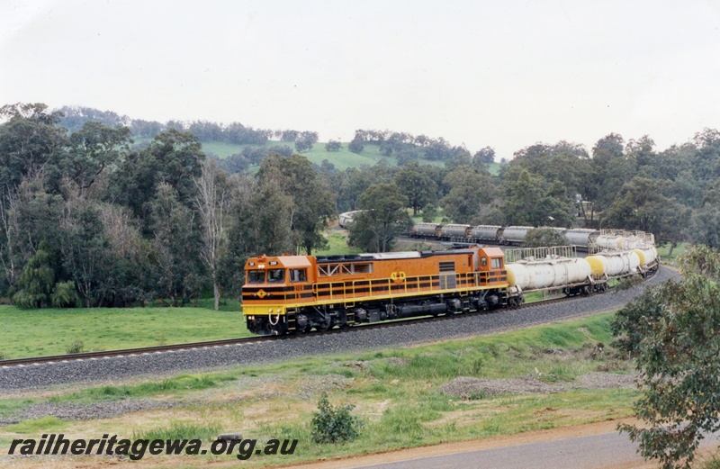 P04399
S class 2109 diesel locomotive on a caustic and alumina train, in orange and black stripe livery, front and side view, between Beela and Brunswick, SWR line.

