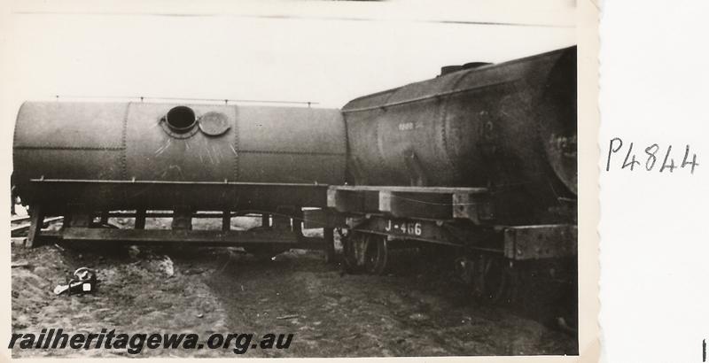 P04844
J class 466 tank wagon with derailed tank wagon. Same incident as depicted in P4843,  derailment at the 328 mile, 28 chain location on the Wiluna Railway, NR line, date of derailment 12/11/1929
