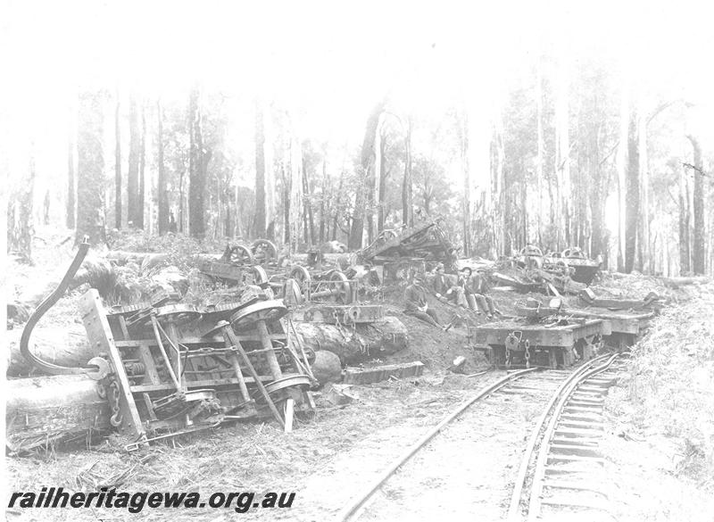 P07100
3 of 5 views of the derailment of SSM loco No.57, Deanmill, view along track showing derailed and overturned wagons

