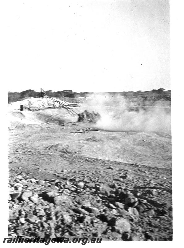 P07298
13 of 19 photos of the construction of the railway dam at Wurarga. NR line, firing off with blasting powder
